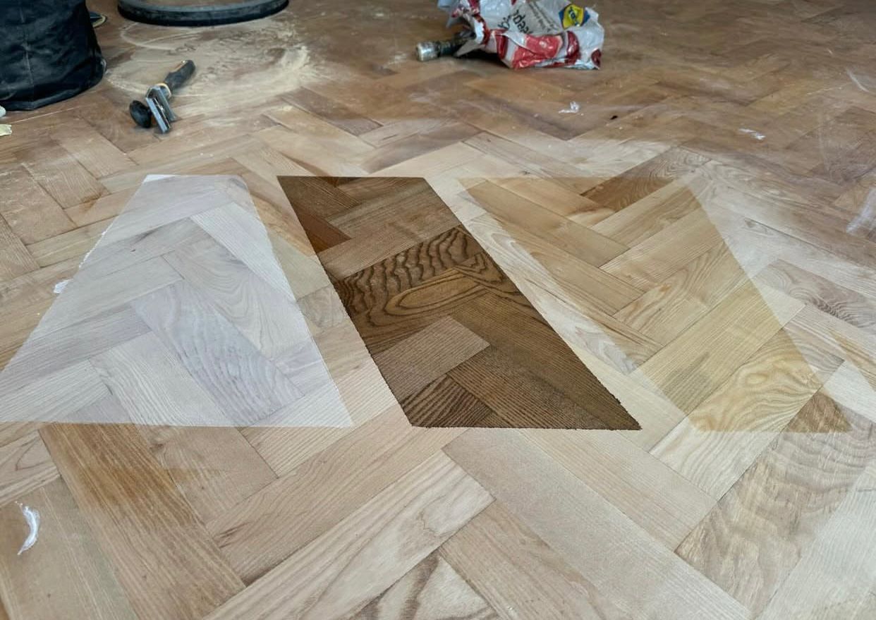 Parquet Floor Sanding in Bicester on an oak herringbone parquet hardwood floor, showing three colour samples tested after sanding